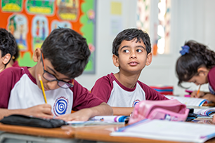 students writing at their desk