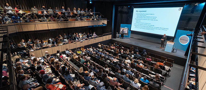 Delegates in auditorium at Cambridge Schools Conference, Cambridge 2019