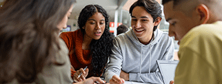 Group of students sitting round a table