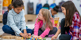 Children playing with toy blocks