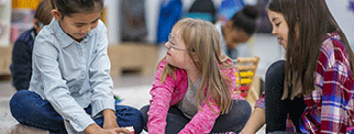 Middle school children learning in classroom setting