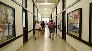 MIT students walking in vibrant hallways