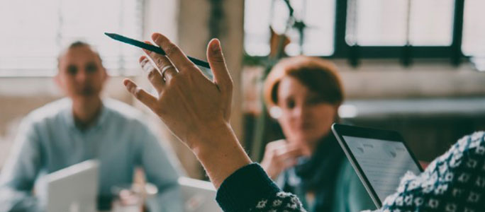 An audience listening to a speaker