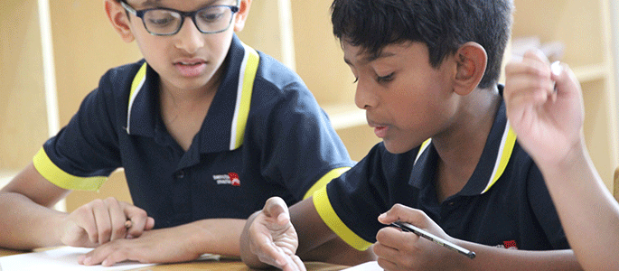 Pupils learning in a classroom