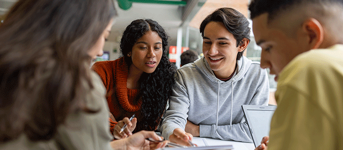 Students studying round a table