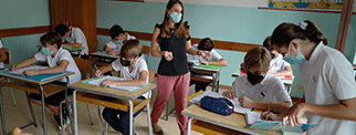 Teachers and students in a classroom - promo image