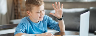 Young learner attending a remote lesson on a computer